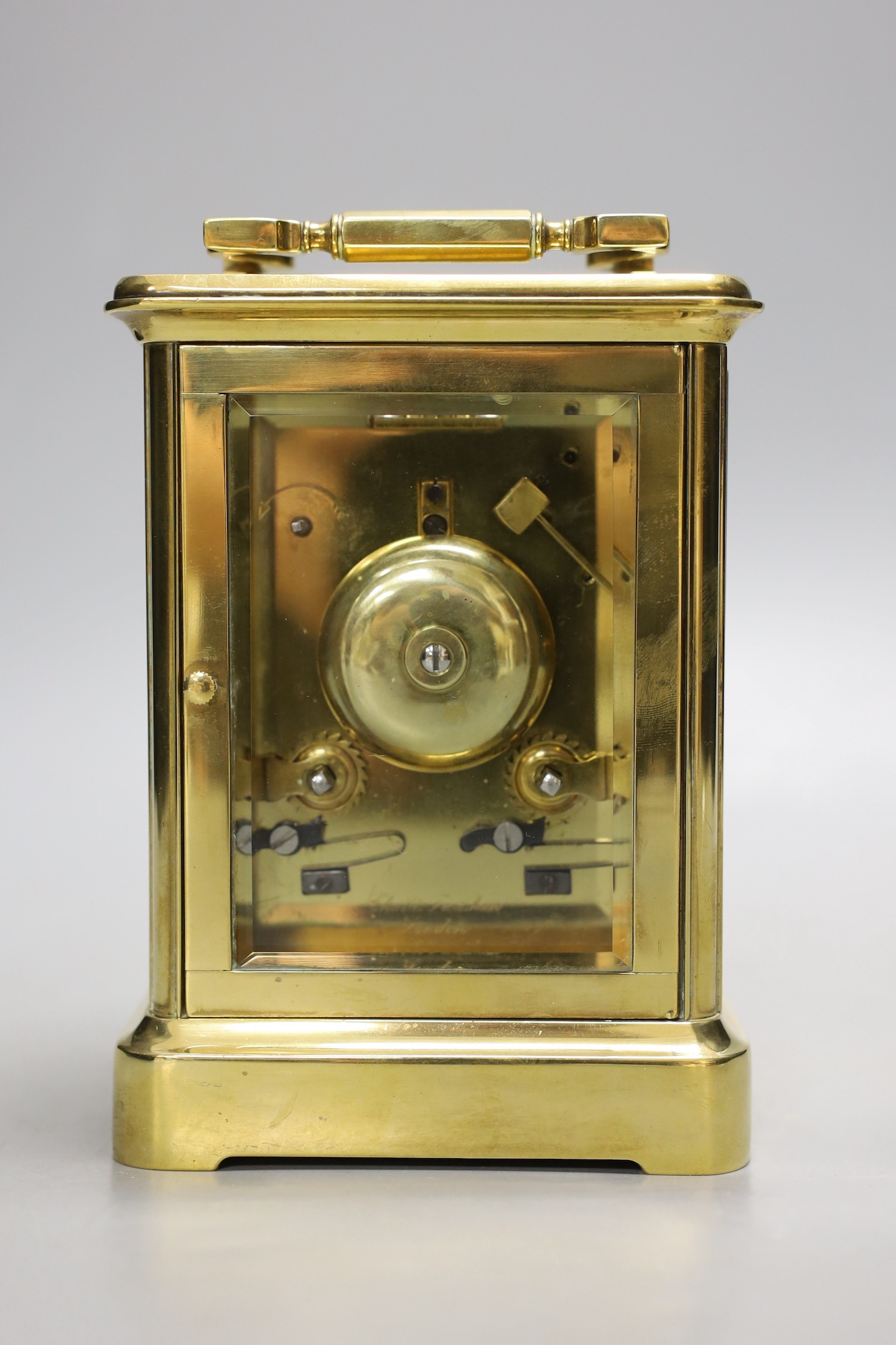 A large brass carriage clock, retail by Charles Frodsham, 14.5 cms high.